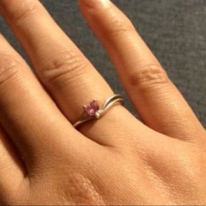Sterling silver ring with a pink heart shaped sapphire. Size 5.5.